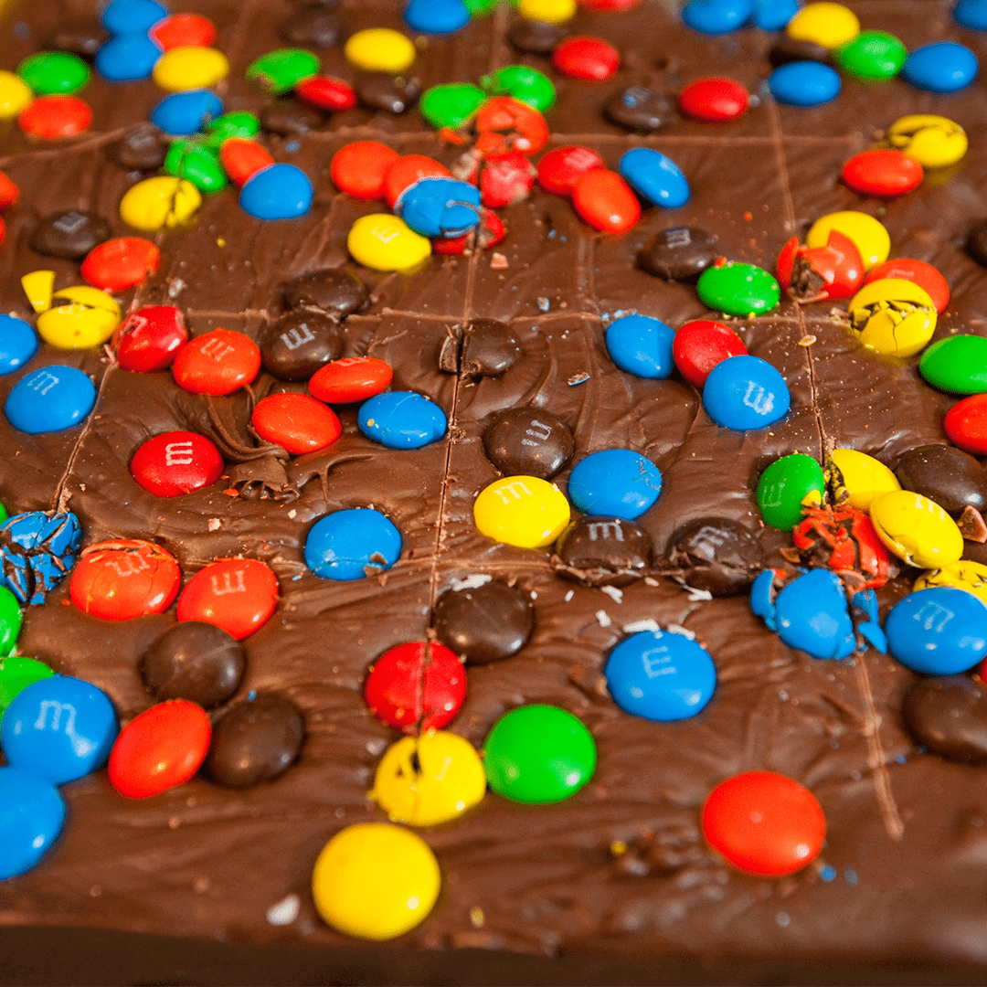 an up close shot of the m&m fudge at nutz about fudge
