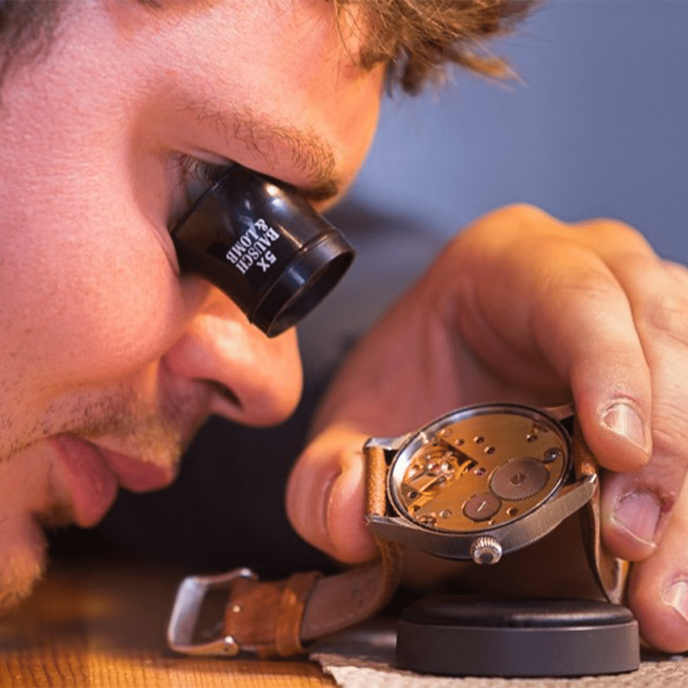 the watchmakers shop repairing a fine watch