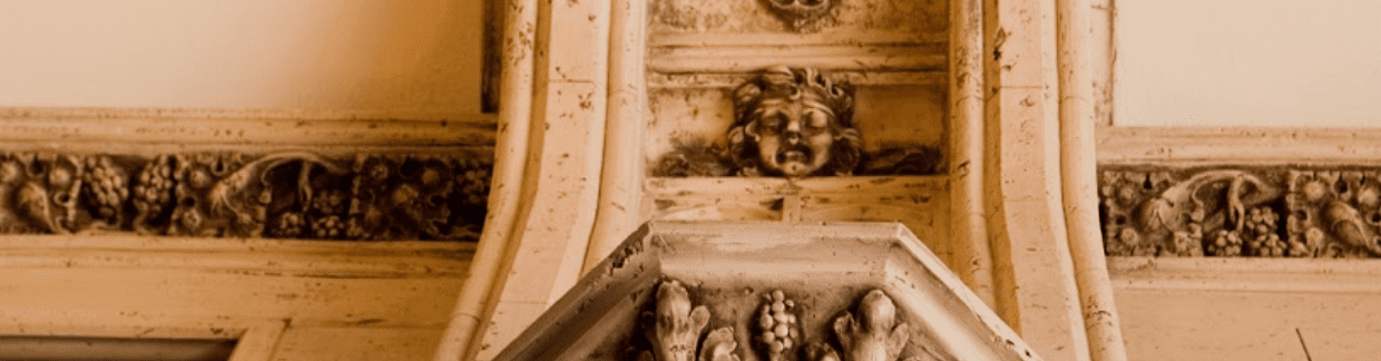 a close up shot of one of the grotesque faces near one of the entrances of the Arcade