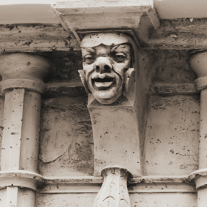 an up close shot of a grotesque face in the interior arcade