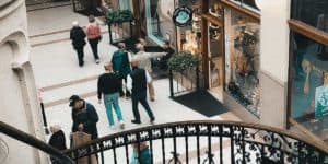 an interior shot of the grove arcade taken from the staircase looking down at customers walking through the arcade.