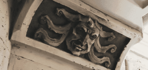 a medusa like head carved into stone