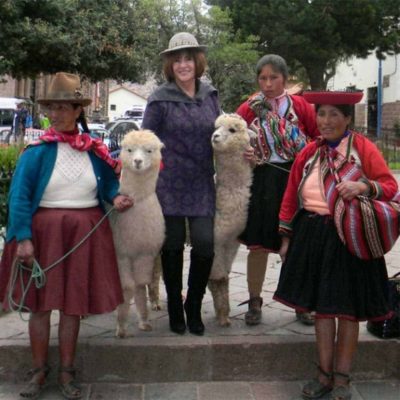 GA_Alpaca Wawa_Featured a photo of the owner of Alpaca Wawa in Peru standing with native Peruvian women and alpacas